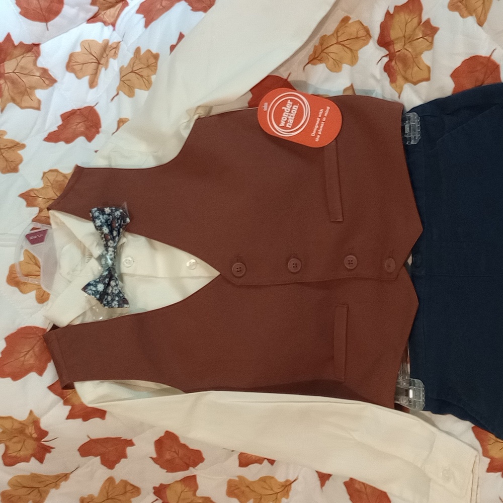 Boys dress up with bow tie in size 6. Navy blue pants with elastic waist band.
